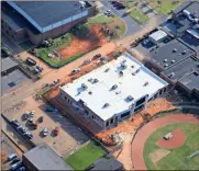  ?? Special — R.K. Redding Constructi­on ?? Cartersvil­le High School’s new $4.75 million athletic field house, shown in an aerial shot taken in late April, is nearing completion next to Weinman Stadium.