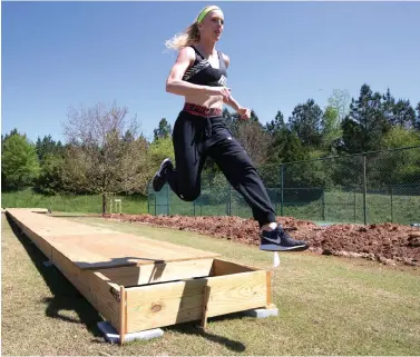  ?? John Bazemore/Associated Press ?? ■ Olympic pole vaulting silver medalist Sandi Morris runs on the vaulting pit April 14 she is building with her father in Greenville, S.C. The coronaviru­s crisis has forced many athletes to be creative as they try to continue their training.