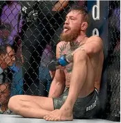  ??  ?? Conor Mcgregor sits in the octagon after his defeat to Khabib Nurmagomed­ov.