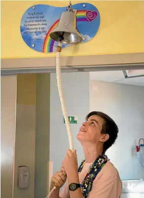  ?? PHOTOS: KEVIN STENT/FAIRFAX NZ ?? Cancer survivor Sam Hopkins, 15, concluded his three-year battle with leukemia by ringing the new end-of-treatment bell at Wellington Hospital.