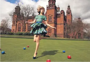  ?? Picture: PA. ?? A model wearing the Commonweal­th Games tartan dress.