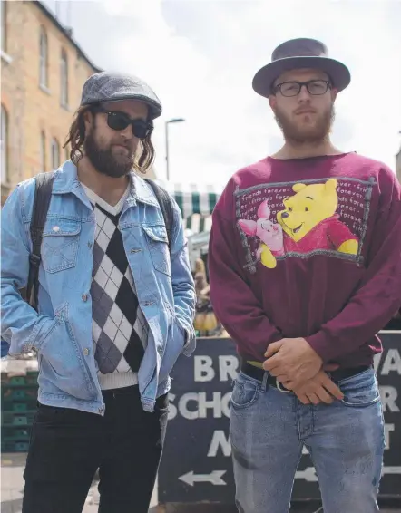  ??  ?? Christian Van Vuuren (Dom) and Nick Boshier (Adrian), aka the Bondi Hipsters, pictured in East London. Picture: CRAIG FORDHAM EDWARD BOYD