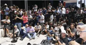  ?? — AFP ?? MADRID: Media wait for Real Madrid’s Portuguese forward Cristiano Ronaldo to hold a press point after appearing before a court in Pozuelo de Alarcon, a wealthy suburb of Madrid, yesterday to answer on four counts of tax evasion of 14.7 million euro...