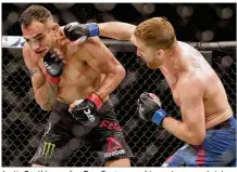  ?? JOHN RAOUX / AP ?? Justin Gaethje punches Tony Ferguson on his way to an upset victory by TKO over his heavily favored opponent in the main event at UFC 249 Saturday in Jacksonvil­le, Fla.