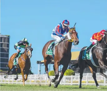  ?? Picture: AAP Image/Michael McInally/Racing Queensland. ?? LEADING HOPE: Soxagon (red and blue silks) is edged out at Eagle Farm on June 6. He looks to go one better at Doomben today.