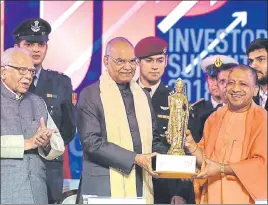  ?? DEEPAK GUPTA/HT PHOTO ?? UP chief minister Yogi Adityanath (right) presents a memento to President Ram Nath Kovind along with governor Ram Naik on the last Day of the UP Investors Summit2018 at the Indira Gandhi Pratishtha­n in Lucknow on Thursday.