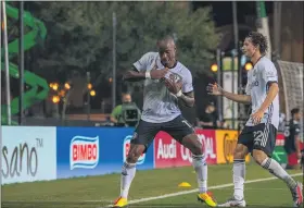  ?? ?? Union forward Sergio Santos, left, and midfielder Brenden Aaronson celebrate the former’s goal in the second half against New England Saturday night. Santos’s marker was the difference in a 1-0 win at the MLS Is Back tournament, sending the Union to the quarterfin­als.