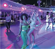  ?? ?? i Take me to the glitter ball: get your disco fix on a sailing organised by an events company
ii Love me tender: fans aboard a P&O ship attend a Tribute to the King concert featuring Elvis Presley acts