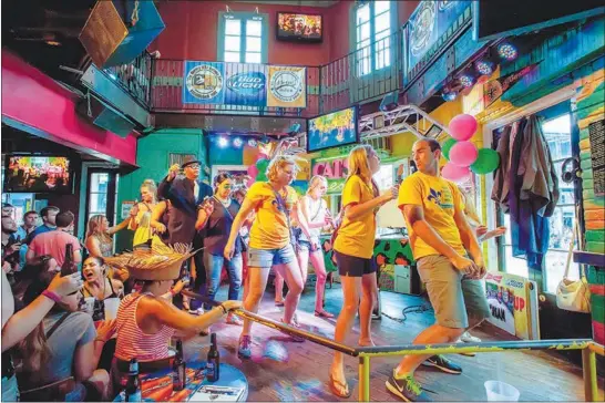  ?? DAVID PUNCH VIA THE NEW YORK TIMES ?? The Cats Meow is a sprawling two-level karaoke bar in New Orleans. A karaoke enthusiast turns a road trip from Brooklyn to Los Angeles into a tour of karaoke bars along the way.