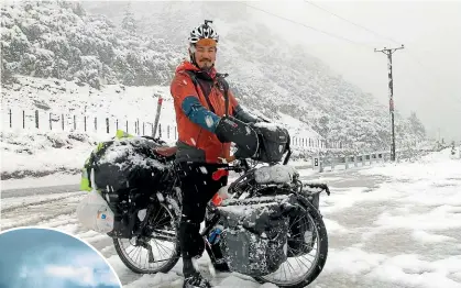  ?? JO MCKENZIE-MCLEAN/STUFF ?? Raymond Lee, 32, was not expecting snow in Queenstown yesterday. The South Korean tourist is biking across New Zealand.