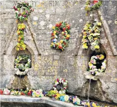  ??  ?? Well-dressed: Seven Wells at Bisley, Gloucester­shire, decorated for Ascension Day