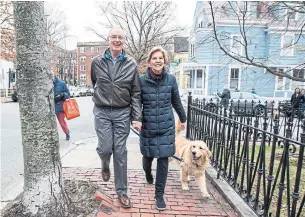  ?? SCOTT EISEN GETTY IMAGES ?? Massachuse­tts Sen. Elizabeth Warren — seen with her husband, Bruce Mann, and dog, Bailey, — released a video on Monday saying she is launching an explorator­y committee for a 2020 run.