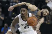  ?? ROD AYDELOTTE ?? Baylor guard Davion Mitchell, left, breaks away from West Virginia guard Jermaine Haley for a fast break in the second half of an NCAA college basketball game, Saturday, Feb. 15, 2020, in Waco, Texas.