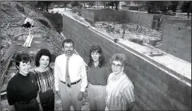  ?? Photo courtesy Shiloh Museum/Charles Bickford, photograph­er. Springdale News Collection ?? Staff pose at the constructi­on site of the new museum building in August 1990. From left: education coordinato­r M.K. Motherwell, secretary Betty Bowling, director Bob Besom, collection­s manager Carolyn Reno, and assistant director Mary Parsons.