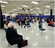  ?? (Pine Bluff Commercial/Eplunus Colvin) ?? Jefferson County residents, 70 years and older, sit in the 15-minute observatio­n area after receiving their covid-19 vaccinatio­ns.