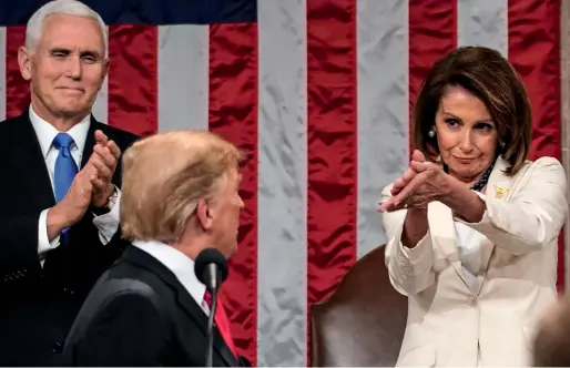  ?? AFP ?? House speaker Nancy Pelosi and Vice-President Mike Pence applaud as President Trump delivers his State of the Union address on Capitol Hill in Washington. Pelosi’s clapping at the event went viral. —