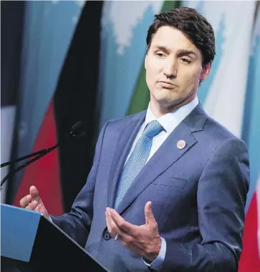  ?? LARS HAGBERG/AFP PHOTO/GETTY IMAGES ?? Prime Minister Justin Trudeau meets the media at the end of the G7 summit Saturday, where he warned President Trump that Canada wouldn’t back down under threats.