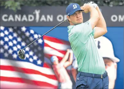  ?? THE CANADIAN PRESS/FRANK GUNN ?? Hudson Swafford keeps an eye on his tee shot on the 10th hole during the first round of the Canadian Open golf at Glen Abbey in Oakville, Ont., on Thursday.