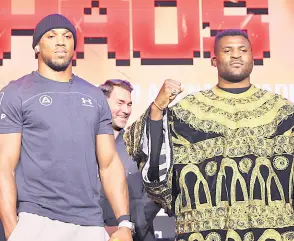  ?? — AFP photo ?? Joshua (left ) and Ngannou pose after a press conference.