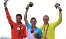  ?? Photograph: Tim de Waele/Getty Images ?? From left, Dutch silver medalist Tom Dumoulin, Slovene gold medalist Primoz Roglic and Dennis.