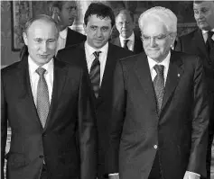  ??  ?? Italy’s President Sergio Mattarella (right) meets Putin in Rome, Italy. — Reuters photo