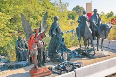  ?? JERRY JACKSON/BALTIMORE SUN ?? Confederat­e statues remain in the corner of a city-owned lot in East Baltimore two years after they were removed.