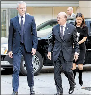  ?? AP/FRANCOIS MORI ?? French Finance Minister Bruno Le Maire (left) welcomes U.S. Secretary of Commerce Wilbur Ross ahead of their Thursday meeting in Paris. Ross said talks with the Europeans about U.S. tariffs on European steel and aluminum were not successful enough to...