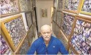  ?? BILL TIERNAN/STAFF ?? Retired Navy Master Chief Petty Officer Bill Goines, 82, stands in the hallway of his Virginia Beach home Thursday morning, with framed pictures of his family and many friends.