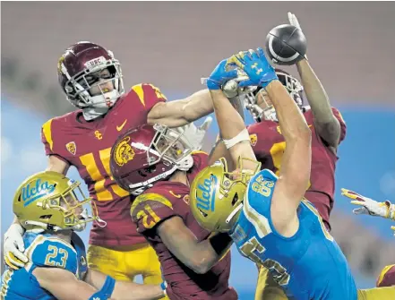  ?? Ashley Landis, The Associated Press ?? UCLA tight end Greg Dulcich ( 85) fails to catch a pass in the end zone as time runs out, securing a comeback USC victory Saturday night in Pasadena, Calif.