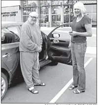  ?? Arkansas Democrat-Gazette/DAVE HUGHES ?? Rickey Dale Newman waits Wednesday with his court-appointed attorney, Julie Brain, for his brother outside the Crawford County jail in Van Buren after murder charges were dismissed against the former death-row inmate. “I’m a little nervous,” Newman...