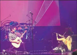  ?? Symphonic Rock Show ?? Brody Dolyniuk, a longtime Las Vegas rocker, and Nina Digregorio perform Oct. 1, 2019, during “Symphonic Rock Show” in Reynolds Hall at The Smith Center for the Performing Arts.