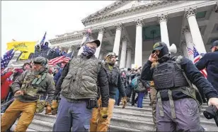  ?? MANUEL BALCE CENETA Associated Press ?? MEMBERS of the Oath Keepers extremist group stand in front of the U.S. Capitol on Jan. 6, 2021. Some Trump supporters are spreading a “Lost Cause” narrative around his presidency.