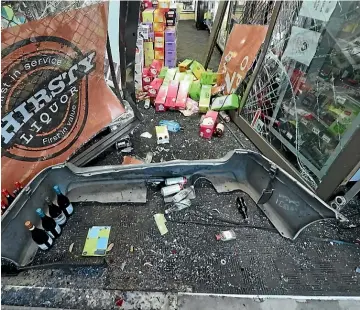  ?? KEVIN STENT/STUFF ?? Damage to a bottle store in Island Bay after a ram-raid. Tawa liquor store owner Kartik Badiyani has called for the rules around installing bollards to be eased.