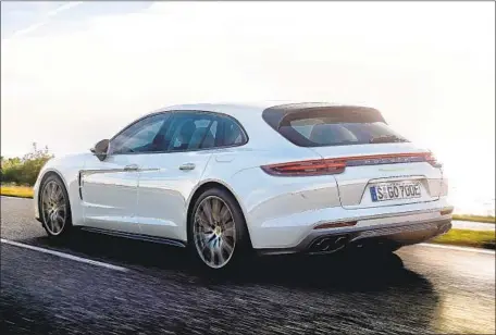  ?? Porsche ?? PORSCHE IS SELLING more Panameras, partly because of hybrid offerings. Above, the Panamera Turbo S E-Hybrid Sport Turismo.