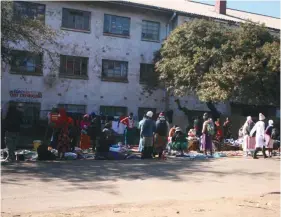  ??  ?? Informal traders sell wares on a street in a Harare suburb in Zimbabwe