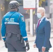  ?? CAROLYN KASTER/AP 2020 ?? GOP leaders say they are opposed to President Biden’s $1.9 trillion plan. Above, Biden, then a presidenti­al candidate, talks to an officer Oct. 19 in Delaware.