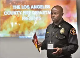  ?? Metro Creative/The Signal ?? (Above) L.A. County Fire Chief Daryl Osby discusses the department’s “Ready, Set, Go!” plan with SCV residents. (Below) The Tick Fire started so fast last week that many residents didn’t have time to prepare to leave.