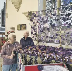  ??  ?? Christine Briggs and Margaret Bussey looking at the Stanground St John’s school display