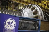  ?? LUKE SHARRETT / BLOOMBERG ?? Beleaguere­d manufactur­er General Electric has agreed to merge its century-old locomotive business with Wabtec Corp. in a deal valued at $11.1 billion.