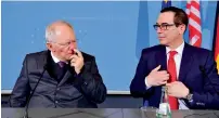  ?? — AFP ?? Wolfgang Schaeuble and Steven Mnuchin during a press conference at the finance ministry in Berlin.