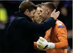  ??  ?? Steven Gerrard congratula­tes keeper Allan McGregor