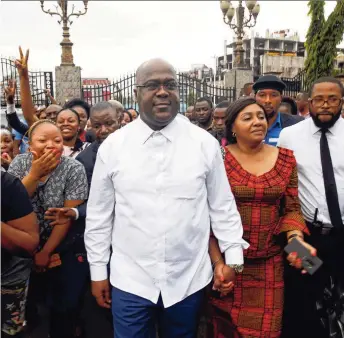  ??  ?? Felix Tshisekedi (links) was vroeger een rivaal van president Kabila, maar sprak de afgelopen dagen lovende woorden over hem. Zijn aanhangers vierden de verkiezing­suitslag in Kinshasa.