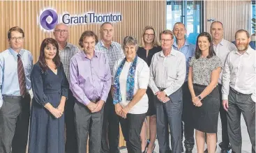  ??  ?? COLLABORAT­IVE: Staff at Grant Thornton Cairns in their refurbishe­d Cairns Corporate Tower offices, including Andrew Cornes, Anthony Beven, Tony Jonsson, Robert Ince, Cathy Devietti, Matt Mullen, Shona Cram, Olivia Van Wensveen, Gerry Mier, Helen Wilkes, Joe Mendiolea and Graham Coonan.