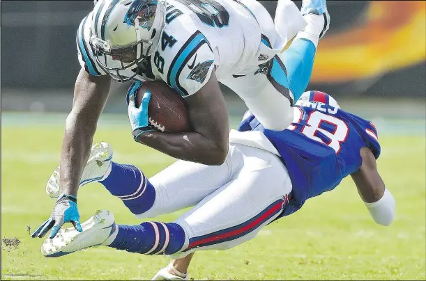  ?? GETTY IMAGES ?? Bills’ E.J. Gaines upends the Panthers’ Ed Dickson on Sunday. Both teams had trouble putting points on the board in the Panthers’ 9-3 win.