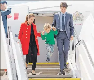 ?? CP PHOTO ?? Prime Minister Justin Trudeau his wife Sophie Gregoire and their son Hadrien wave as they arrive for the G20 summit Thursday in Hamburg, Germany.