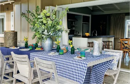  ??  ?? THIS PAGE (clockwise from top) The outdoor dining table comfortabl­y seats 10 and is only a short walk away from the kitchen bench. Rebecca loves the slower pace of life at Waimarama, and the luxury of time over her summer break. Decoration­s from Redcurrent, which Rebecca co-owns.