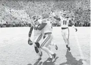  ?? GETTY IMAGES FILE PHOTO ?? Gators starting safety Keanu Neal, seen here with the ball against Tennessee last year, remains sidelined by an unspecifie­d leg injury and continues to receive treatment.