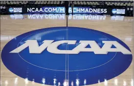  ?? THE ASSOCIATED PRESS FILE PHOTO ?? The NCAA logo is displayed at center court as work continues at The Consol Energy Center in Pittsburgh, for the NCAA college basketball tournament.