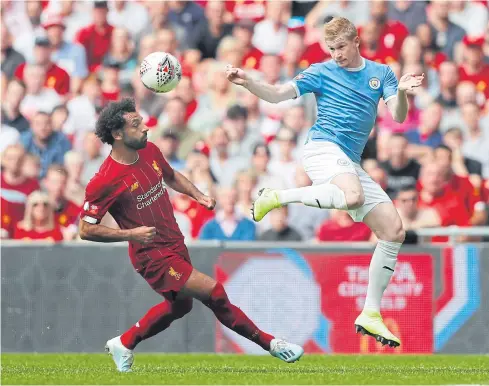  ?? AP ?? Manchester City’s Kevin De Bruyne, right, vies with Liverpool’s Mohamed Salah during the Community Shield match on Sunday.