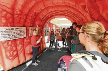  ?? Lori Van Buren / Albany Times Union ?? A pink inflatable intestine, much like this one, was taken from a truck Oct. 18 in Kansas City, Mo. The stolen colon, used to raise awareness about colorectal cancer, quickly became a social media sensation.